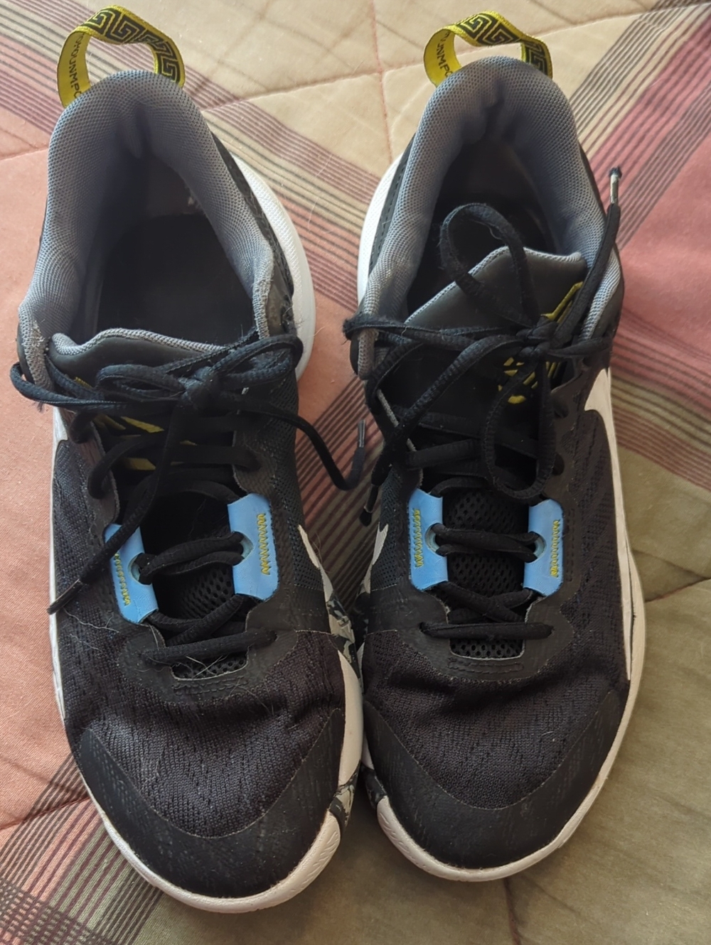 Nike Black and Gray Athletic Shoes with Blue and Yellow Accents